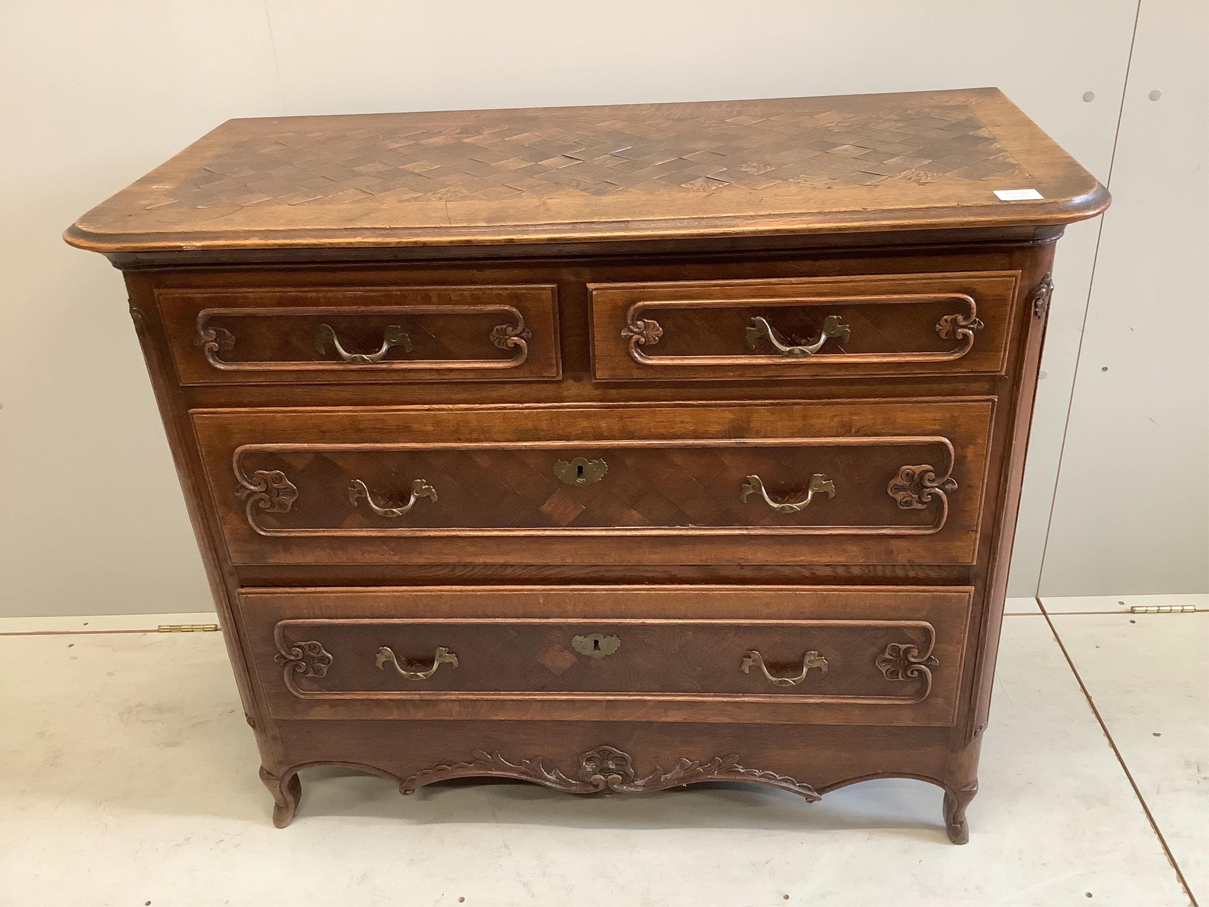 An early 18th century French oak and parquetry commode, width 110cm, depth 52cm, height 92cm